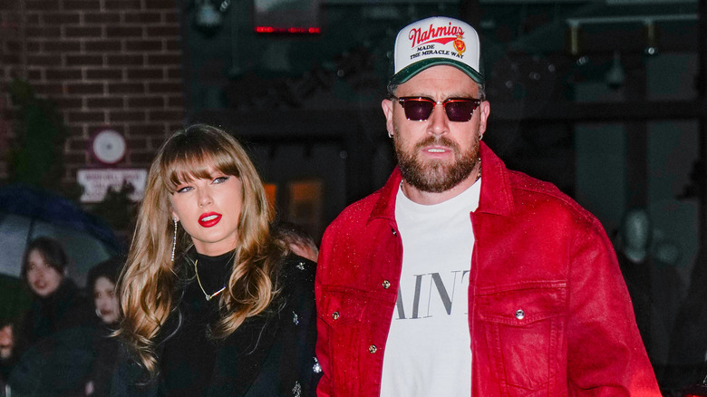 Travis Kelce and Taylor Swift walking