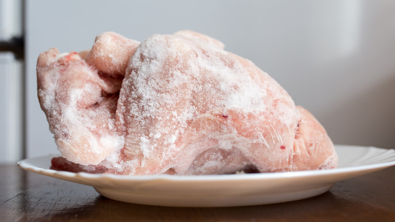 Chicken thawing on a counter