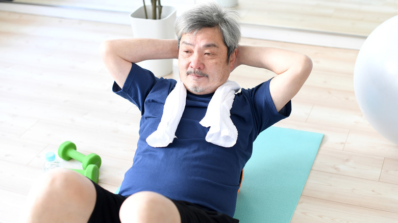 Senior man doing crunches