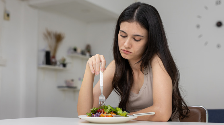 Woman eating a salad