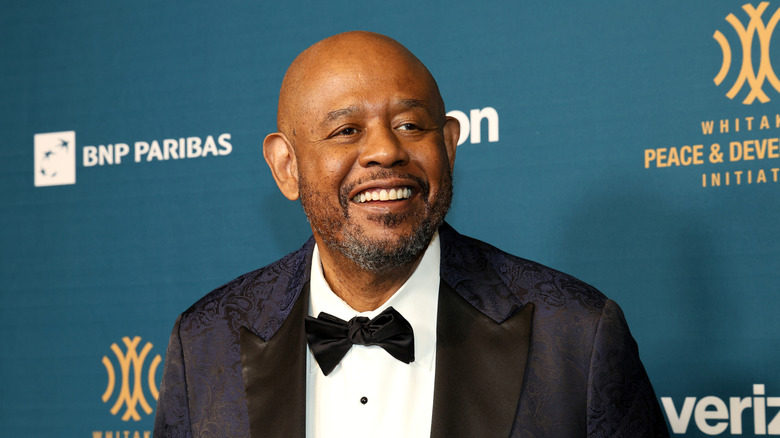 Forest Whitaker smiling for an image taken at a celebrity event