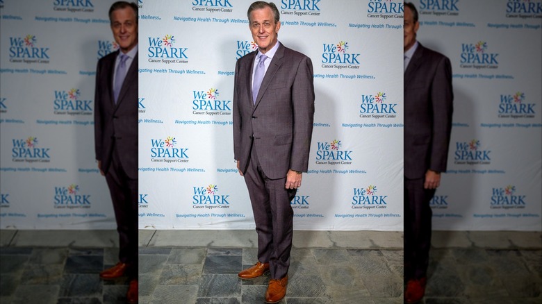 Billy Gardell posing in a suit