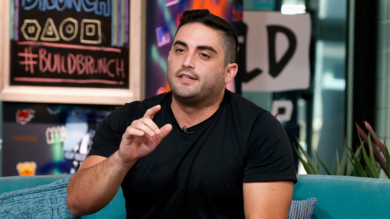 Jared Freid in a seated discussion during an event