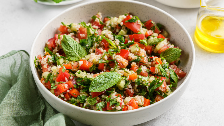 A bowl of salad with olive oil