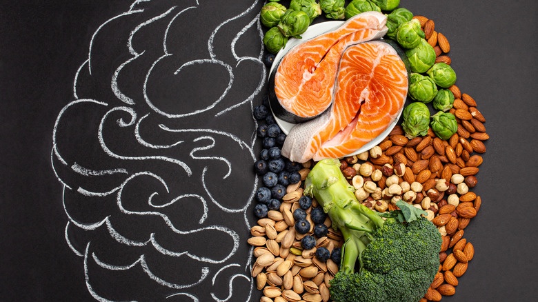 A photo of a chalk-drawn brain next to food