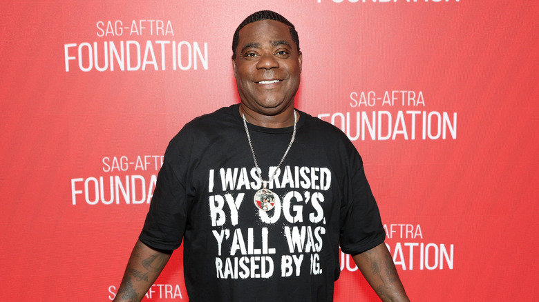 Tracy Morgan posing in a black tee