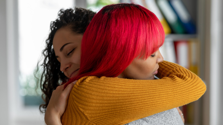 Two women hugging