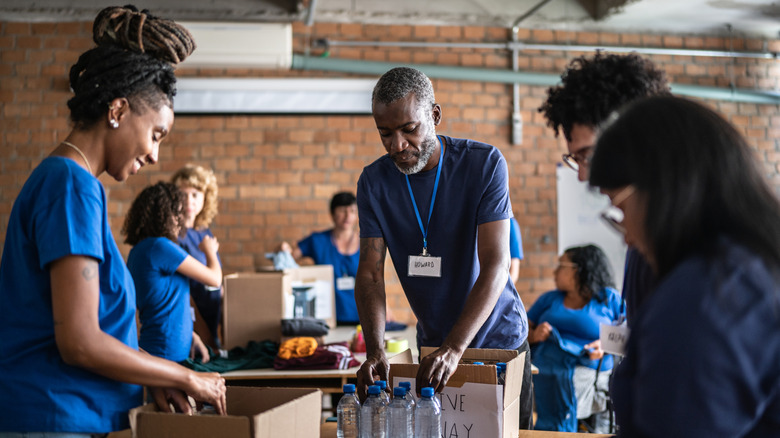 Volunteers sorting donations